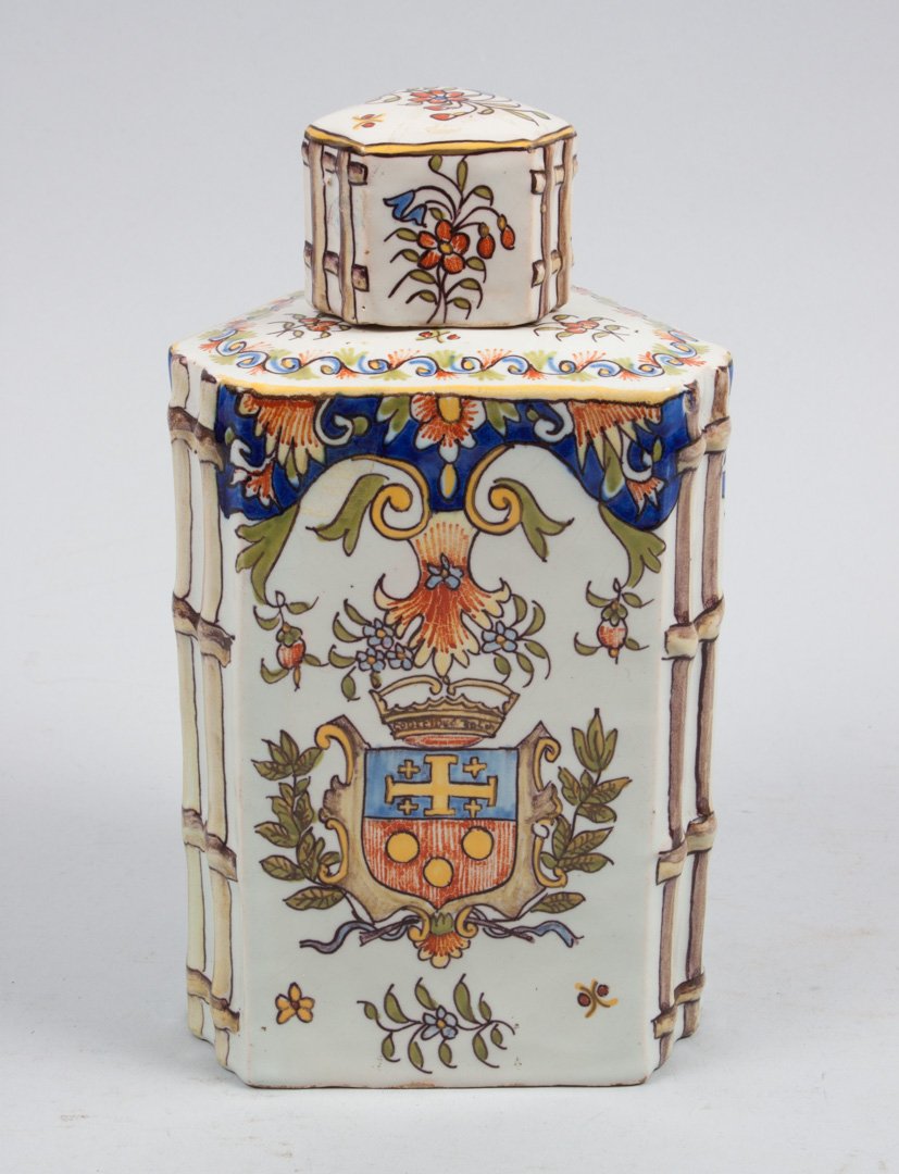Desvres faience ginger jar: circa 1879-87; triangular base and lid with armorial and floral decoration, marked underneath, Fourmaintraux Freres, 8 in. H.
