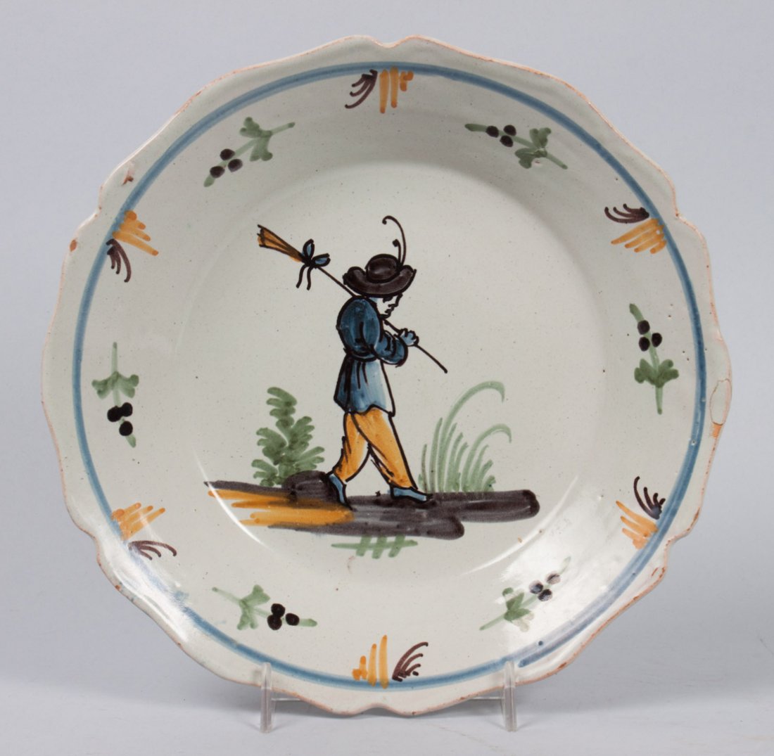 Nevers faience bowl: late 18th/early 19th century; with foliate decoration and figure of farmer, 9 in. Diam.