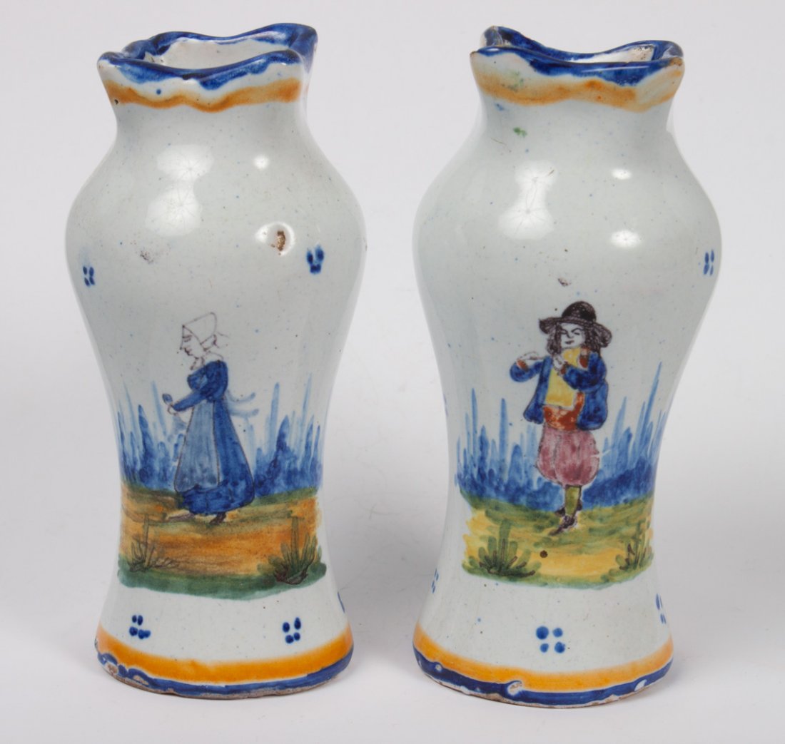 Pair of Malicorne faience bud vases: early 20th century; each vase with floral and figural decoration, 4 1/2 in. H.