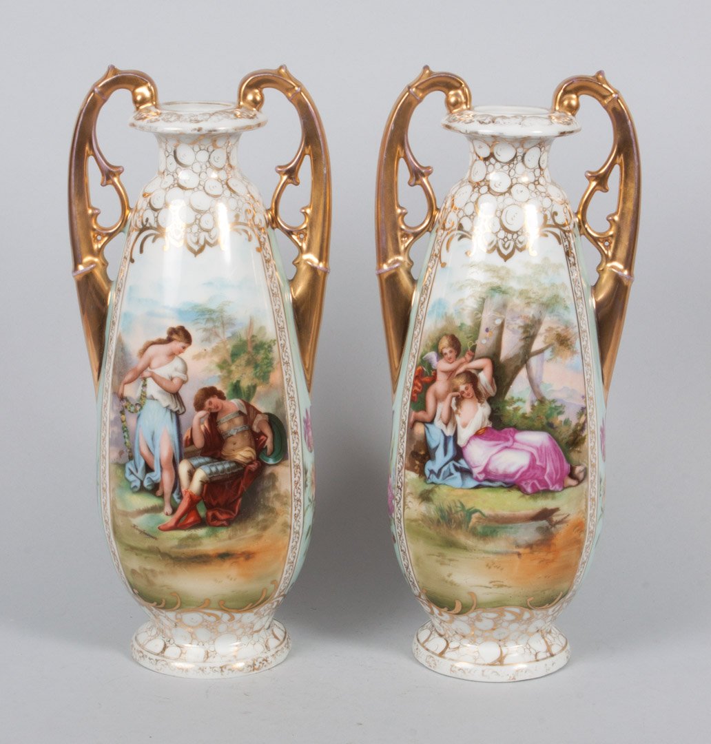 Pair of Continental porcelain mantel vases: early 20th century; German or Austrian, with painted classical vignettes and parcel-gilt decoration, pseudo Schierholz mark, 14 in. H.