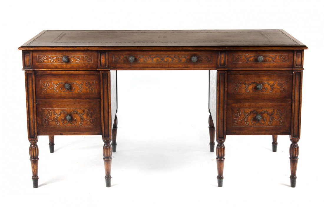 Edwardian style oak partner's desk: inset tooled leather top, brass inlay, three drawers, each side support with two drawers on turned legs, other side with pseudo drawers, 30 in. H., 58 in. W., 29 in. D.