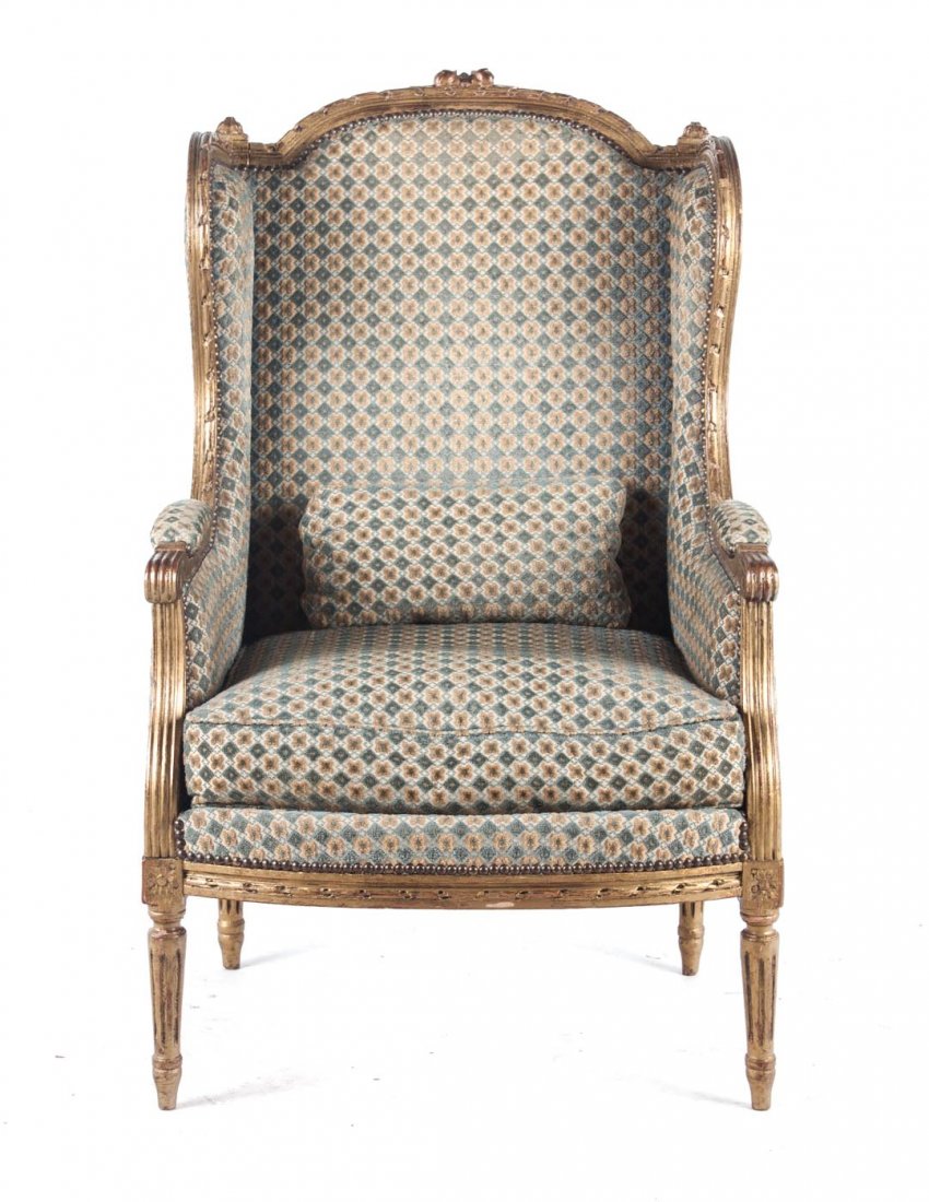 Louis XVI style giltwood bergere: late 19th century; reeded arms and supports, turned legs, 41 in. H., 25 in. W.