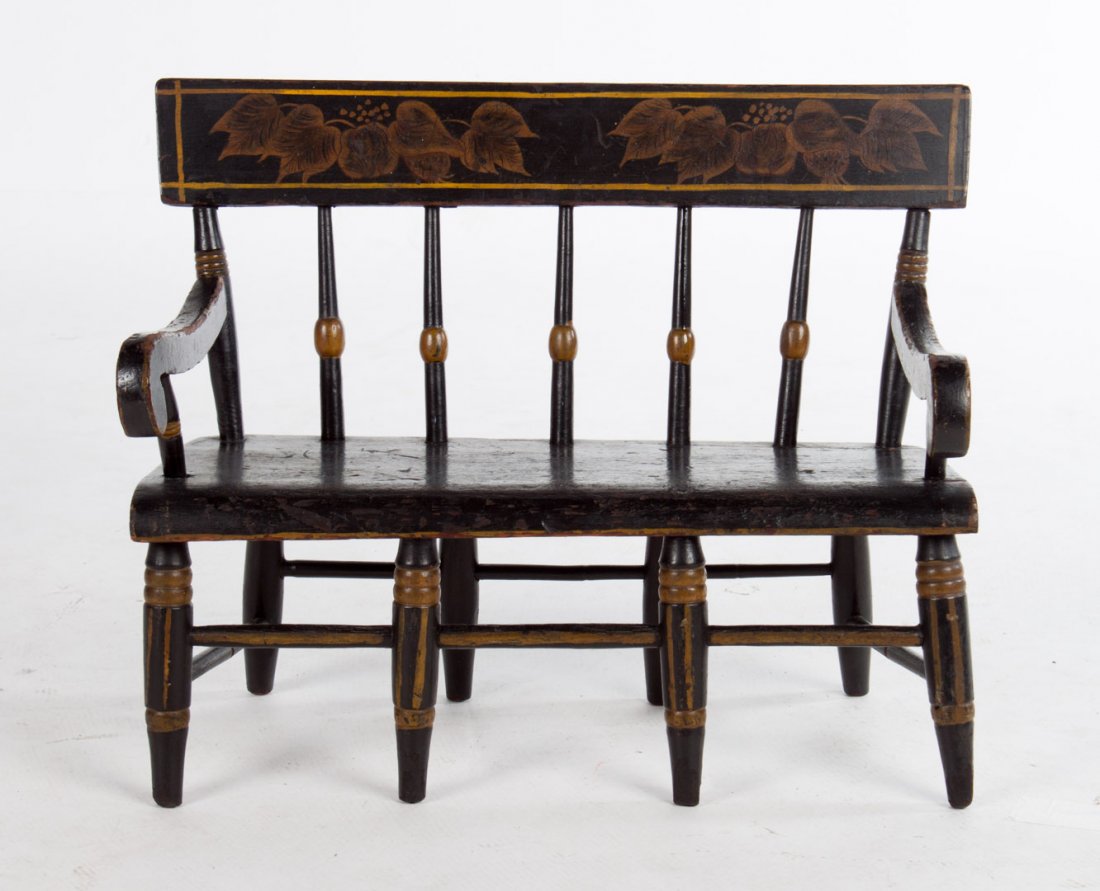 Federal miniature Windsor settee: early 19th century; ebonized wood with fruit and leaf painted crest rail, five-spoke back splat, each with yellow paint highlights, and similar highlights on front legs and stretcher, 17 in. H., 20 in