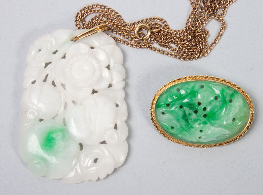 Two carved jade jewelry items: 1) carved jade oval plaque in 14K gold setting, 1 1/2 in. W.; 2) carved Mutton fat jade flower pendant, 2 1/2 in. L.; together with a gold-filled chain, 24 in. L.