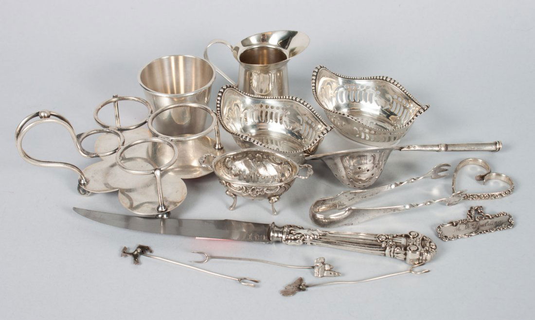 Group of Continental & American silver table items: comprising 15 pieces, including: 2 Gorham nut dishes, 4 Mexican silver Hors dâ€™oeuvre forks, unmarked tea strainer, small cream pitcher, shot glass, German salt cellar, heart-shape napkin ring,