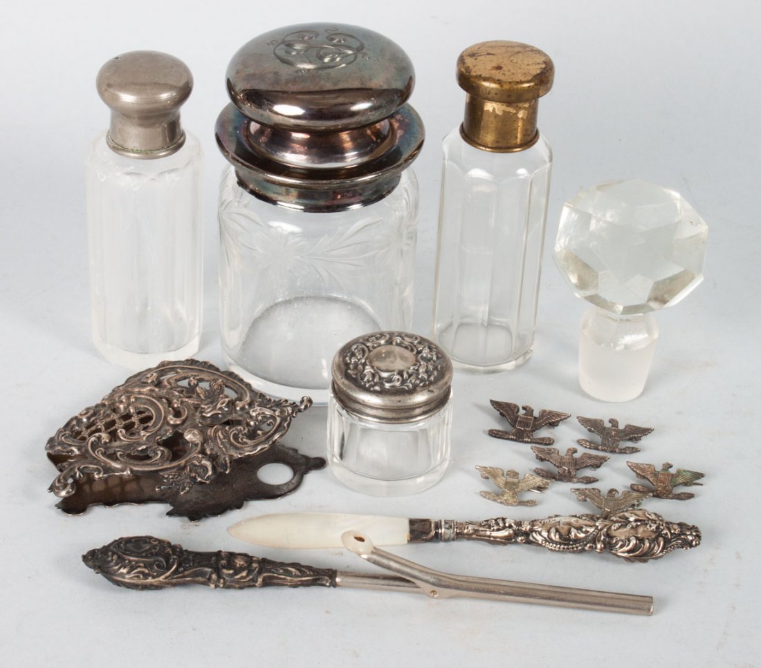 Group of silver-mounted & sterling dresser items: and personal items, including: 2 sterling silver mounted cut glass dresser jars (the tallest 4 1/2 in. H.), sterling silver note clip, sterling handled glove stretcher, and a sterling handled letter o