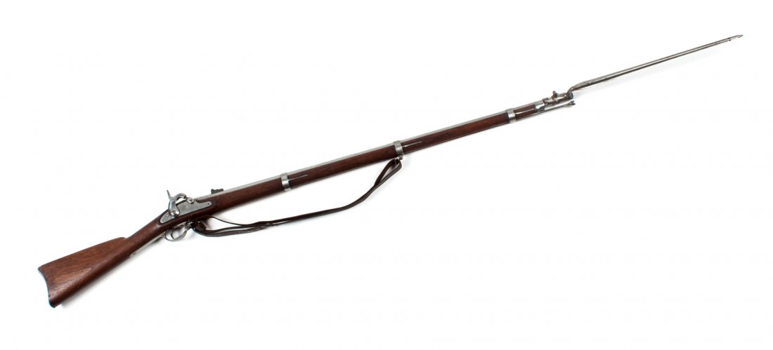 Firearm: Springfield Model 1861 rifle musket: dated 1862; .58 cal.; the steel with bright finish; barrel 40 in. L.; walnut stock; 58 in. L. overall; together with ramrod, period leather sling, and bayonet