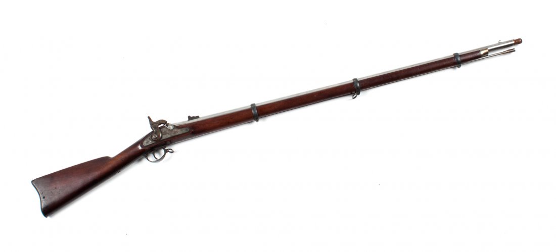 Firearm: Springfield Model 1863 rifle musket: dated 1863; .58 cal.; bright finished barrel, 40 in. L.; case-hardened lock; walnut stock; 55 3/4 in. L. overall; with ramrod and wooden tompion