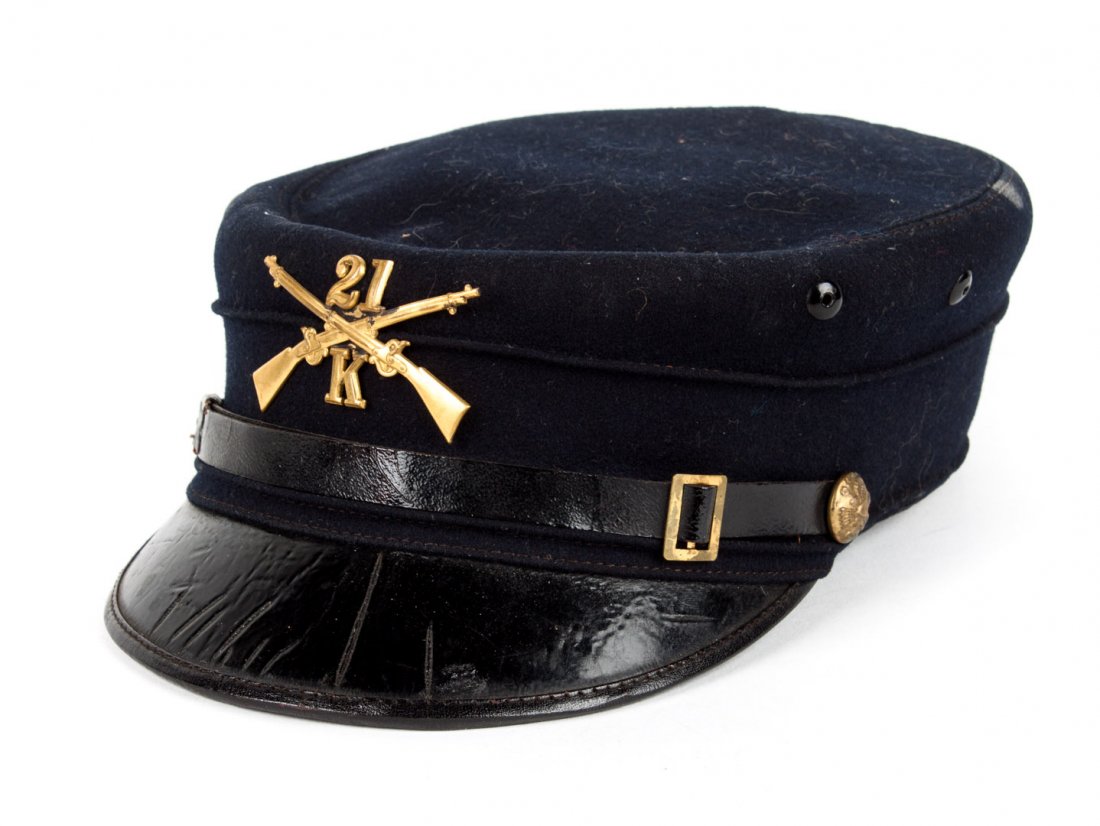 United States regular Army uniform cap: of the Spanish American War period: blue wool forage cap with insignia of Co. K., 21st Infantry Regiment, U.S. regulars; 10 3/4 in. L., 7 1/8 in. W.