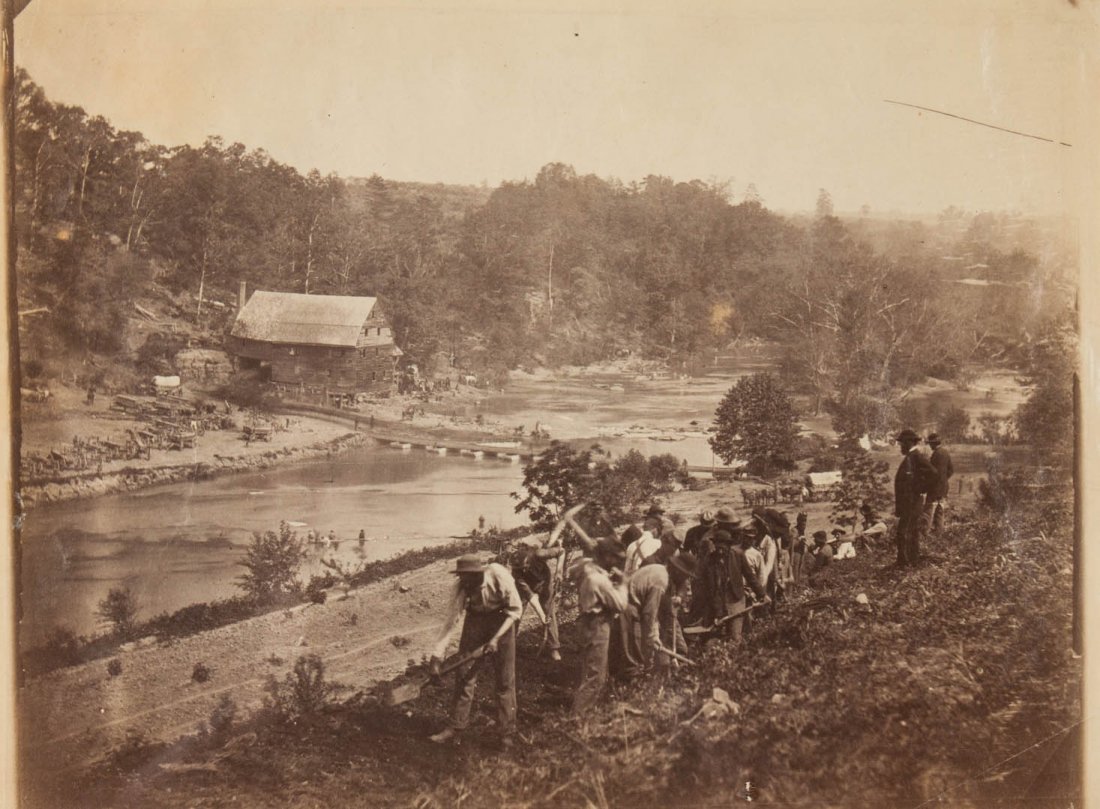 Photograph: Pontoon Bridge at Jericho Mills: with laborers constructing a road up the steep bank of the North Anna, (50th Regt. NY Engineers, Maj. Beers, May, 1864); by O'Sullivan or Gardner; vintage print, 7 1/4 X 9 5/8 in.; framed