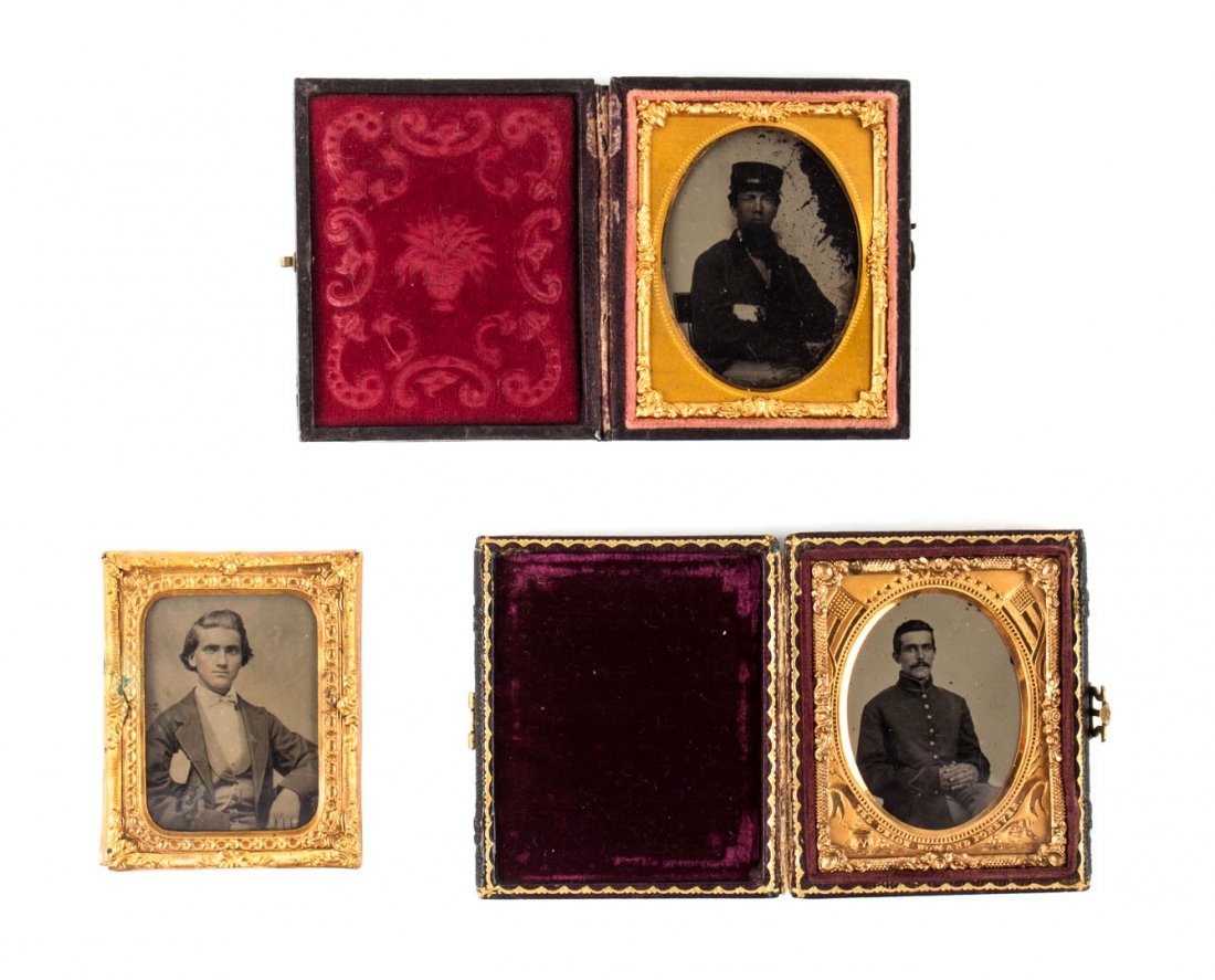 Photographs: Two portraits of Union soldiers: both ambrotypes, 2 1/2 X 2 in., in oval-window mats, stamped leather cases; together with an ambrotype portrait of a young man in a suit, 2 1/2 X 2 in., no case