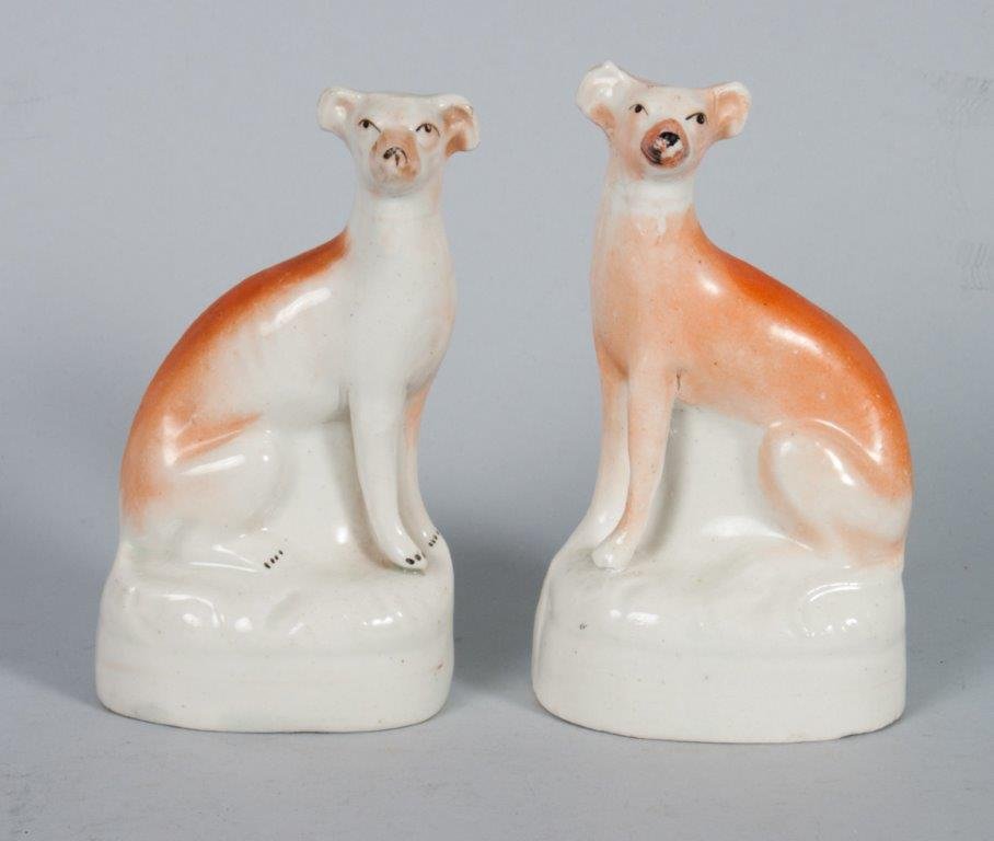 Pair of Staffordshire earthenware whippets: 5 in. H.