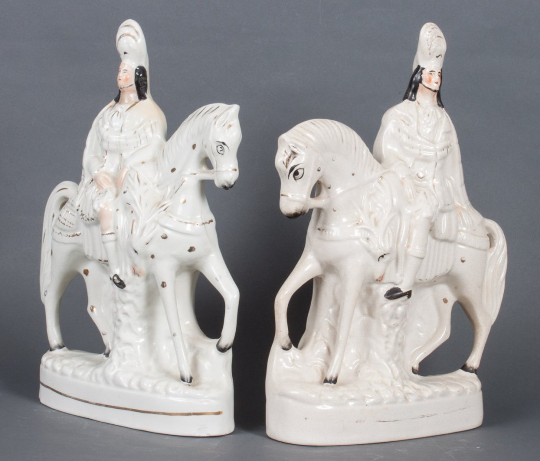 Two Staffordshire earthenware mounted figures: second half-19th century; similar figures of mounted Highlander, one with game deer and other without, 15 in. H.