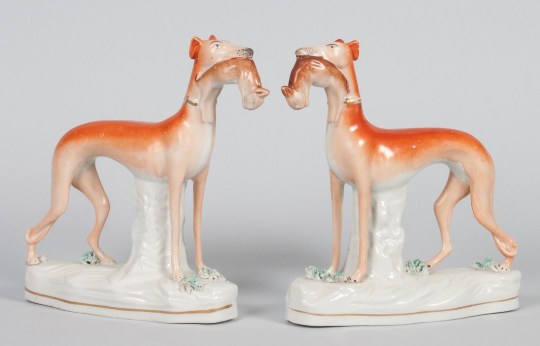 Pair of Staffordshire earthenware whippets: modeled as dog with rabbit in mouth, 7 1/2 in. H.