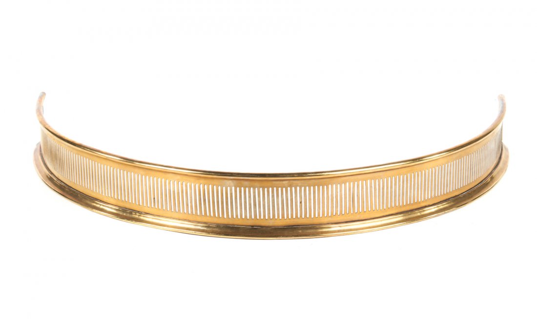 Victorian demilune pierced sheet brass fire fender: late 19th century; 4 in. H., 36 in. W., approx. 20 in. D.
