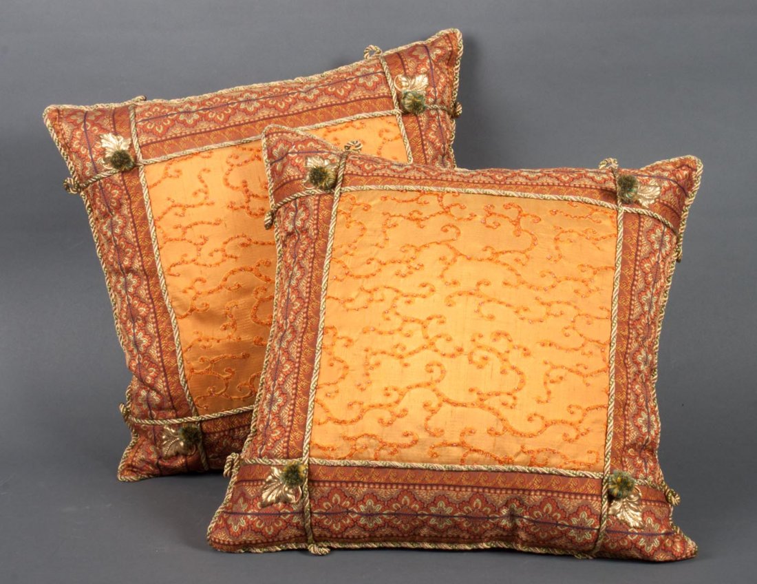 Pair of decorator throw pillows: each with gilt-metal leaf and tassel decoration and applied beads, 15 in. Sq.