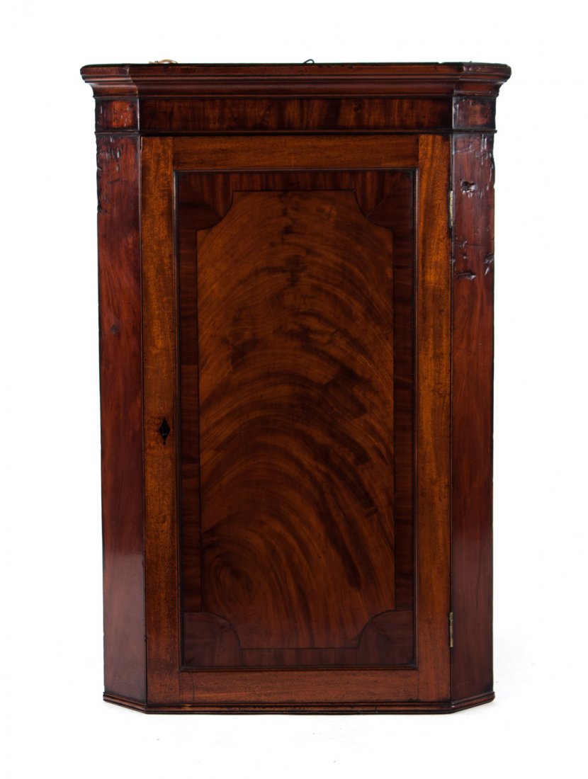 George III mahogany hanging corner cabinet: circa 1800; single ebony inlaid solid panel door, 47 in. H., 31 in. W.