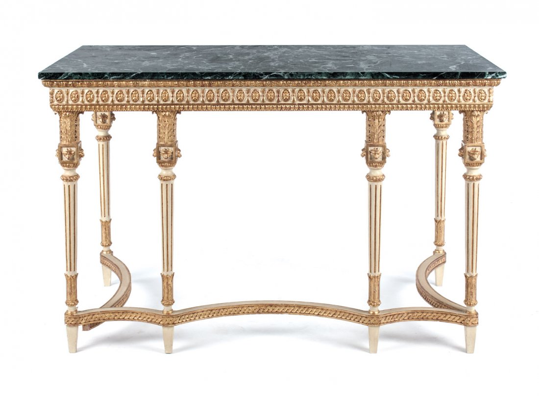 Louis XVI style marble top parcel-gilt pier table: Green variegated marble top, 4 in. apron, six white painted parcel-gilt fluted tapered legs with foliate capitals connected by shaped carved stretchers, 34 1/2 in. H., 54 1/4 in. W., 29 1/2 in. D.
