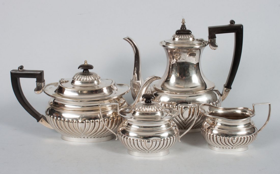 Sheffield silver-plated coffee/tea service: with ebonized wood handles, including: coffee pot (9 in. H.), teapot, covered sugar bowl, and cream pitcher
