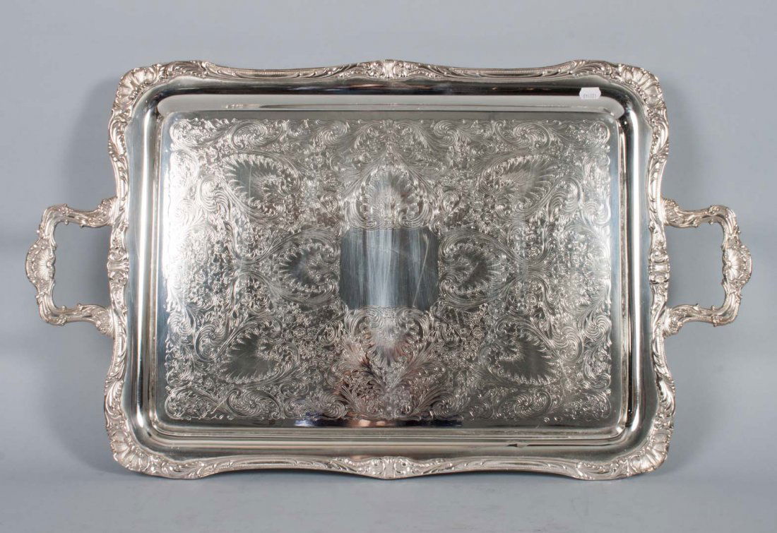Wm. Rogers silver-plated two-handled tray: engraved tray, repousse trim, 28 in. L. over handles, 16 1/2 in. W.