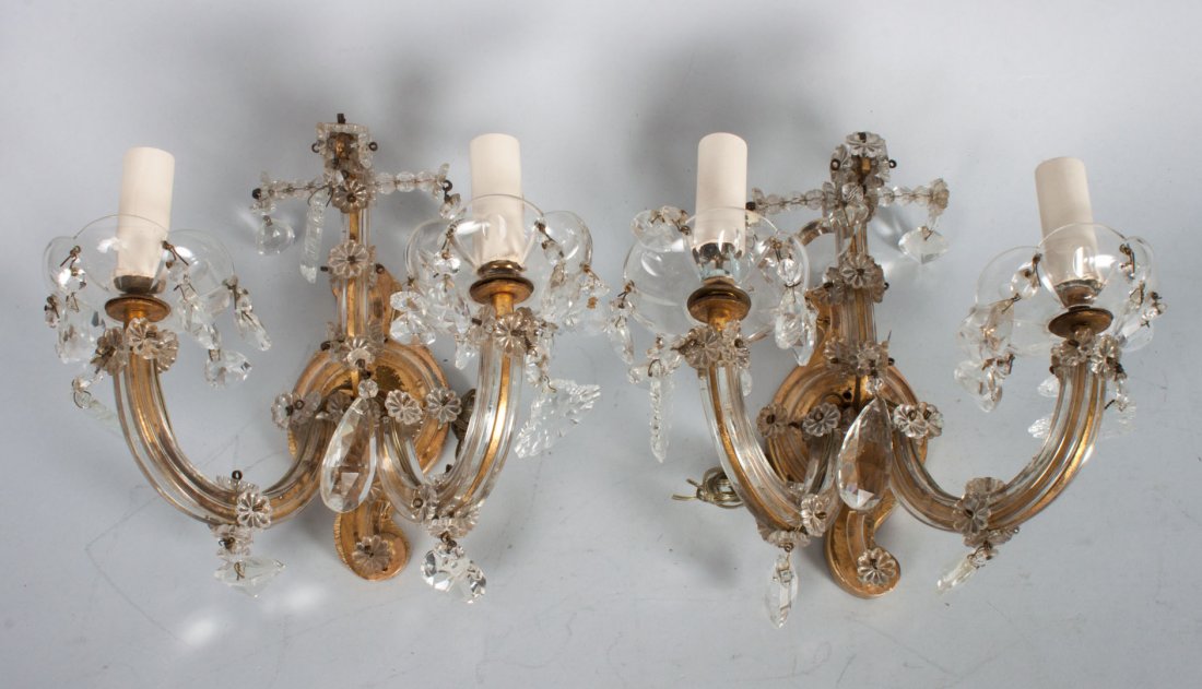 Pair of venetian glass and giltwood sconces: two-light sconces with giltwood backing with applied rosettes and drop prisms, 8 in. H., 9 in. W.