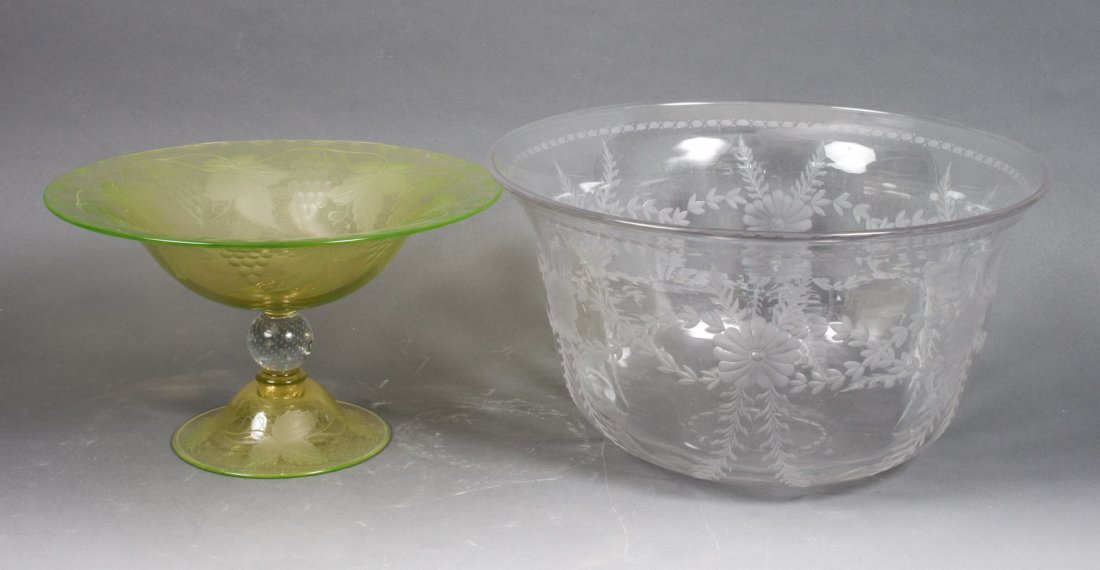 Two pieces of etched glass: clear etched glass center bowl, probably Pairpoint, 8 in. H., 14 in. Diam., and a Bohemian grapevine etched vaseline glass compote, 7 in. H. 12 in. Diam.