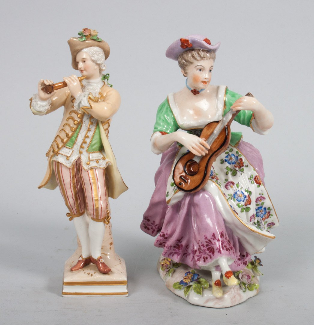 Two Austrian porcelain figures: KPM piper, in 18th century attire, with stamp mark, 6 1/2 in. H., and Vienna porcelain 19th century woman guitarist, 7 in. H.