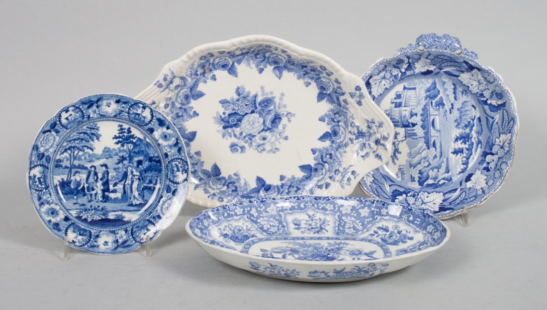 Four Staffordshire blue transferware dishes: first quatrer-19th century; including: two Spode floral decorated serving dishes, "Semi-China" serving dish, and a dessert plate, probably Spode, 6 1/2 to 11 in. Diam.