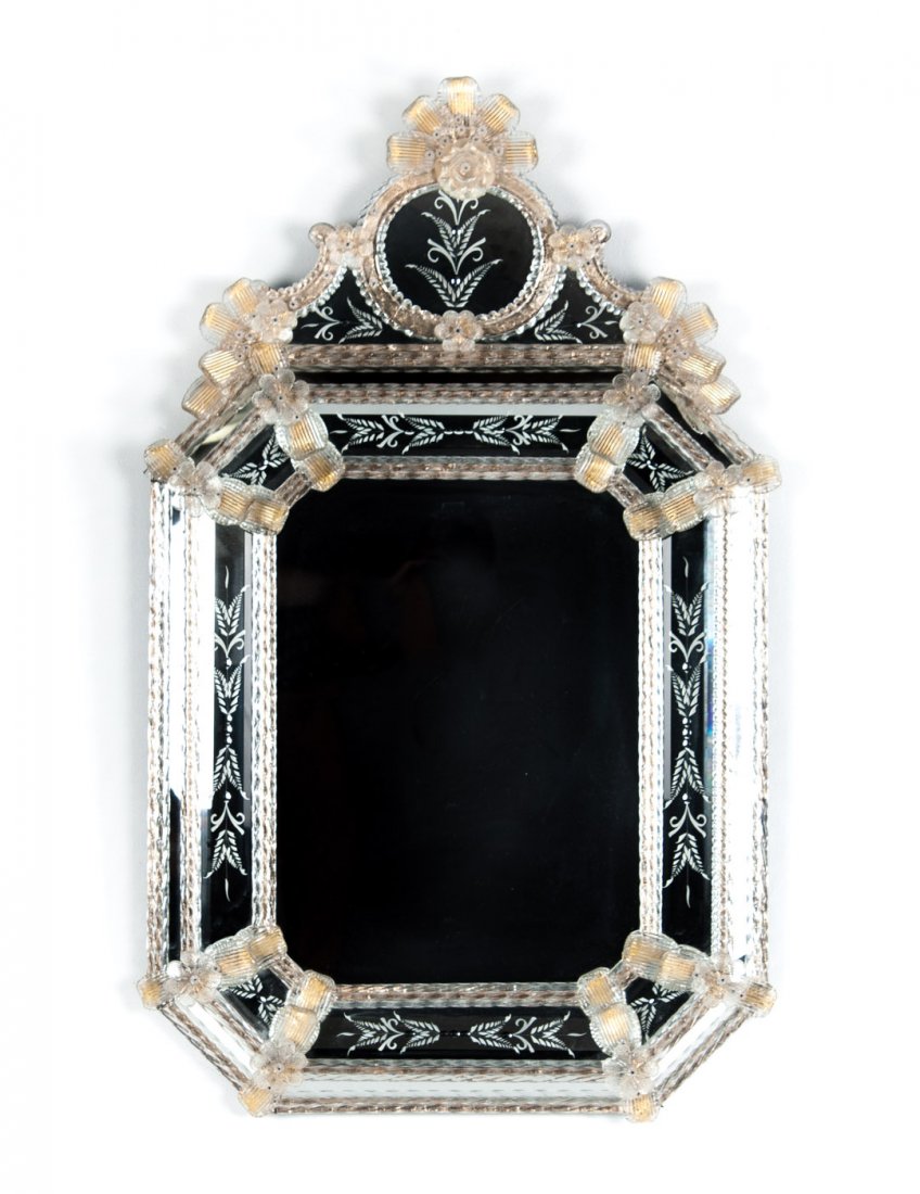 Venetian etched glass mirror: with gold fleck decoration, applied rosettes, and floral etched mirrored glass, 44 in. H., 26 in. W.
