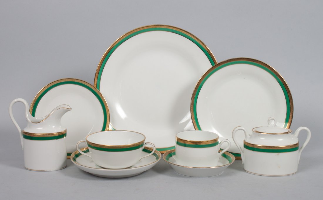 Richard Ginori porcelain partial dinner service: 77 pieces, each with gilt and apple green band, comprising: 12 dinner plates, 12 dessert bowls, 14 luncheon plates, 12 teacups, 8 saucers, 8 bread plates, 8 bouillon cups, single-serving teapot, sugar