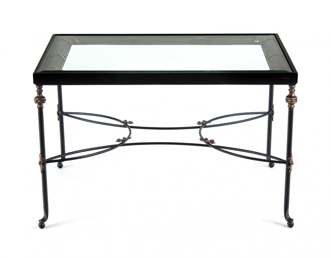 Black gilt glass top wrought iron coffee table: beveled glass top, wrought iron legs connected by shaped stretches, 23 in. H., 36 in. W., 26 in. D.