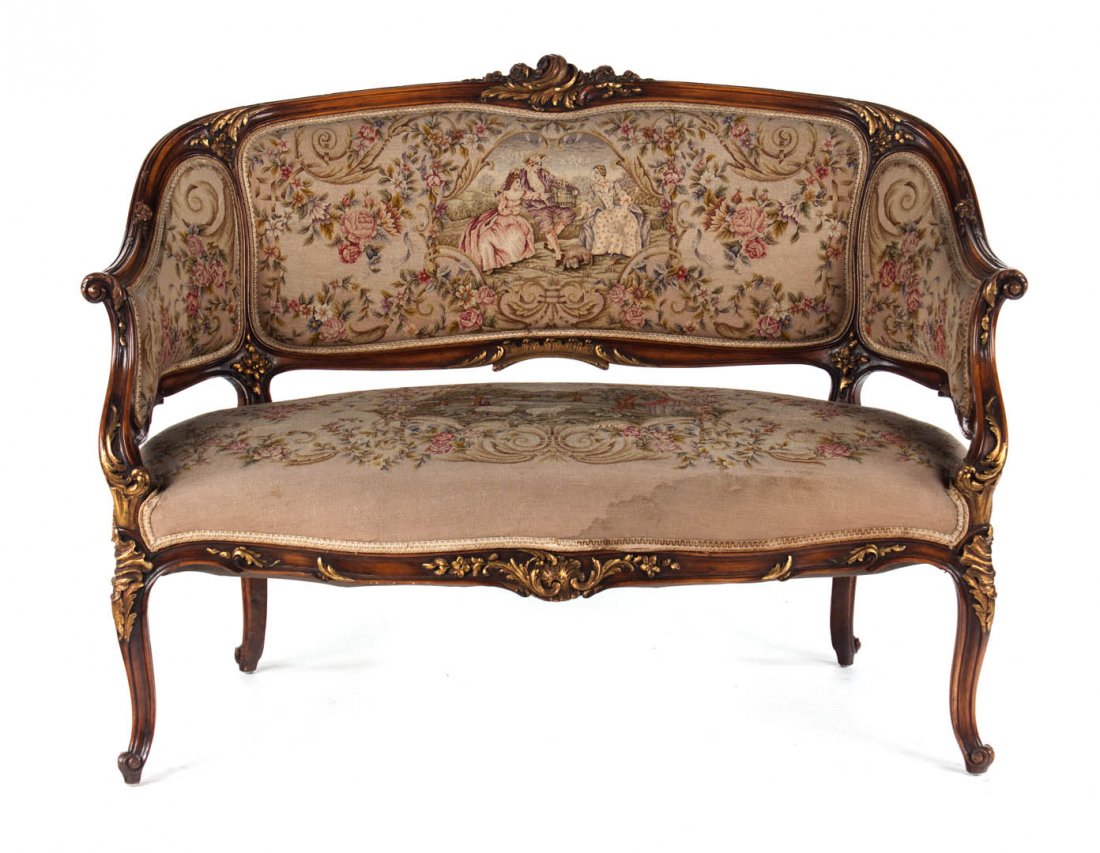 Louis XV style upholstered settee: foliate carved parcel-gilt exposed frame, needlepoint upholstered back, arms, and seat, 35 1/2 in. H., 49 in. W., 23 in. D.