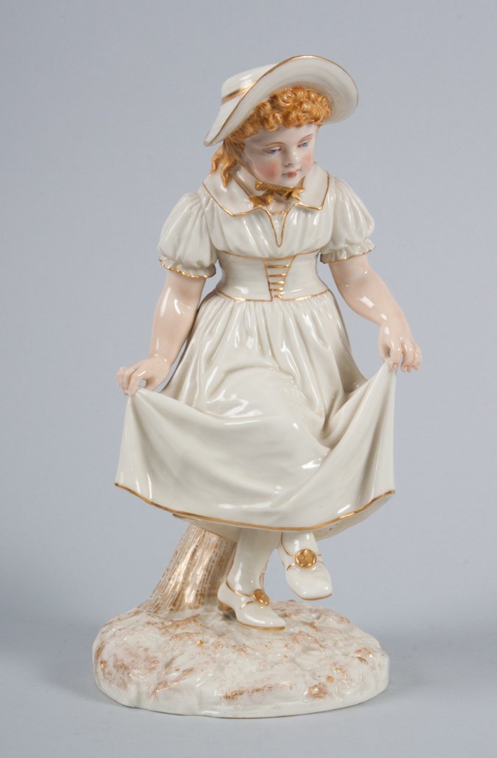 Royal Worcester porcelain figural spill vase: first quarter-20th century; modeled as a young girl skipping with hollow log vase, designed by James Hadley, 10 in. H.