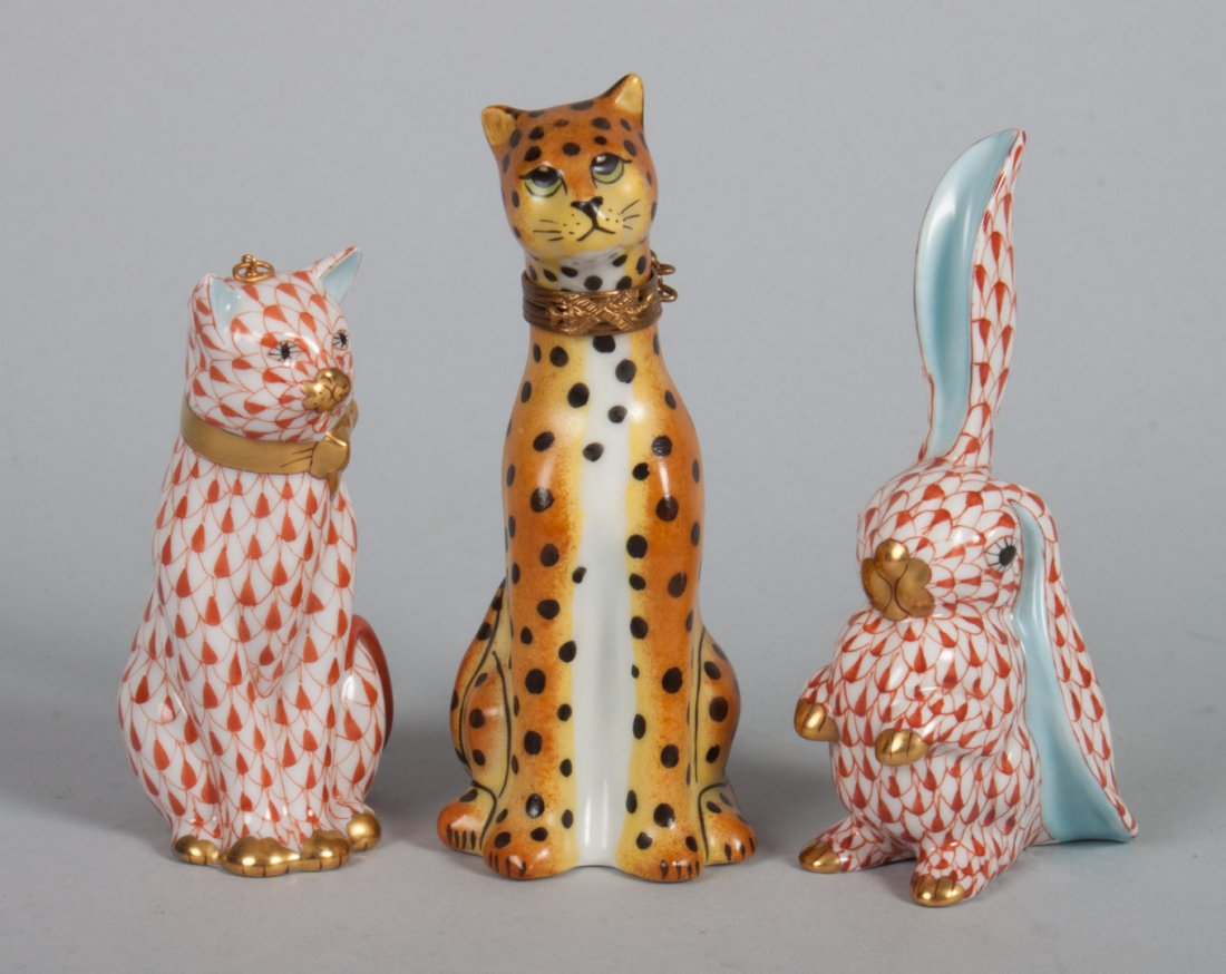 Three Herend and Limoges porcelain animals: cat and bunny in the "Rust Fishnet" pattern, 3 1/2 and 4 in. H., and a Limoges gilt-metal-mounted porcelain leopard-form box, 4 in. H.