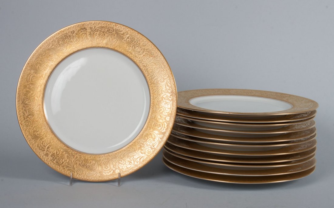 12 Heinrich gilt and porcelain cabinet plates: gilt band with foliate and floral decoration, pseudo Limoges mark, 11 in. Diam.