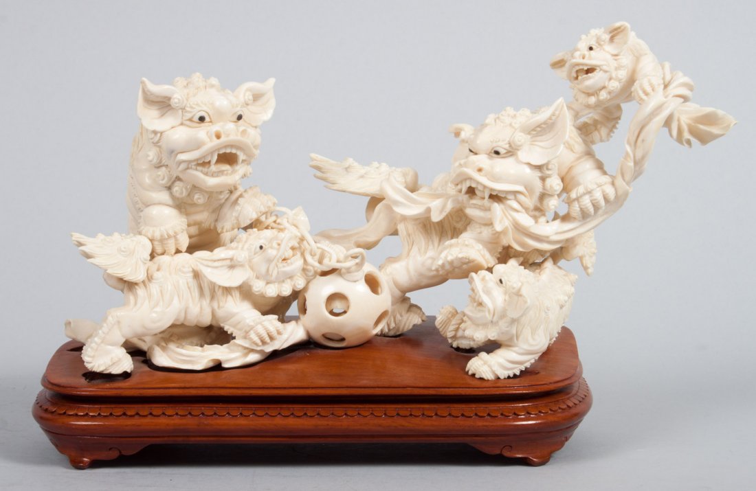 Chinese carved ivory dragon group: group of 5 dragons with puzzle ball, on fitted wood base, 7 in. H., 10 in. W.