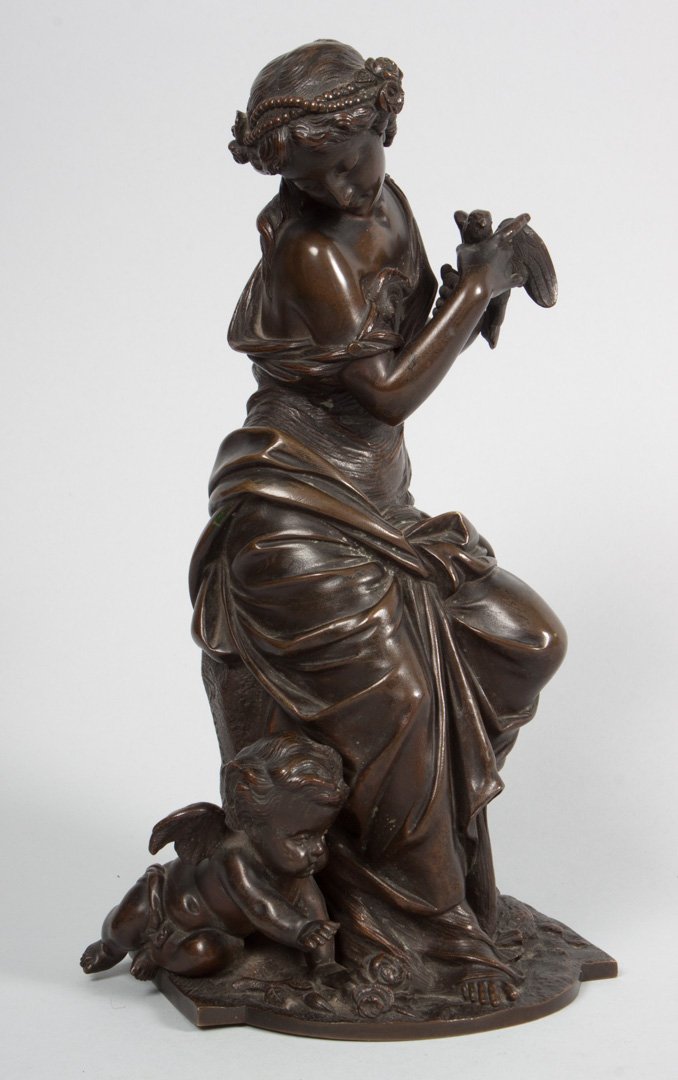 Classical style bronze sculpture: early 20th century; modeled as Venus and Cupid, signed in cast "Ravet," 10 in. H.