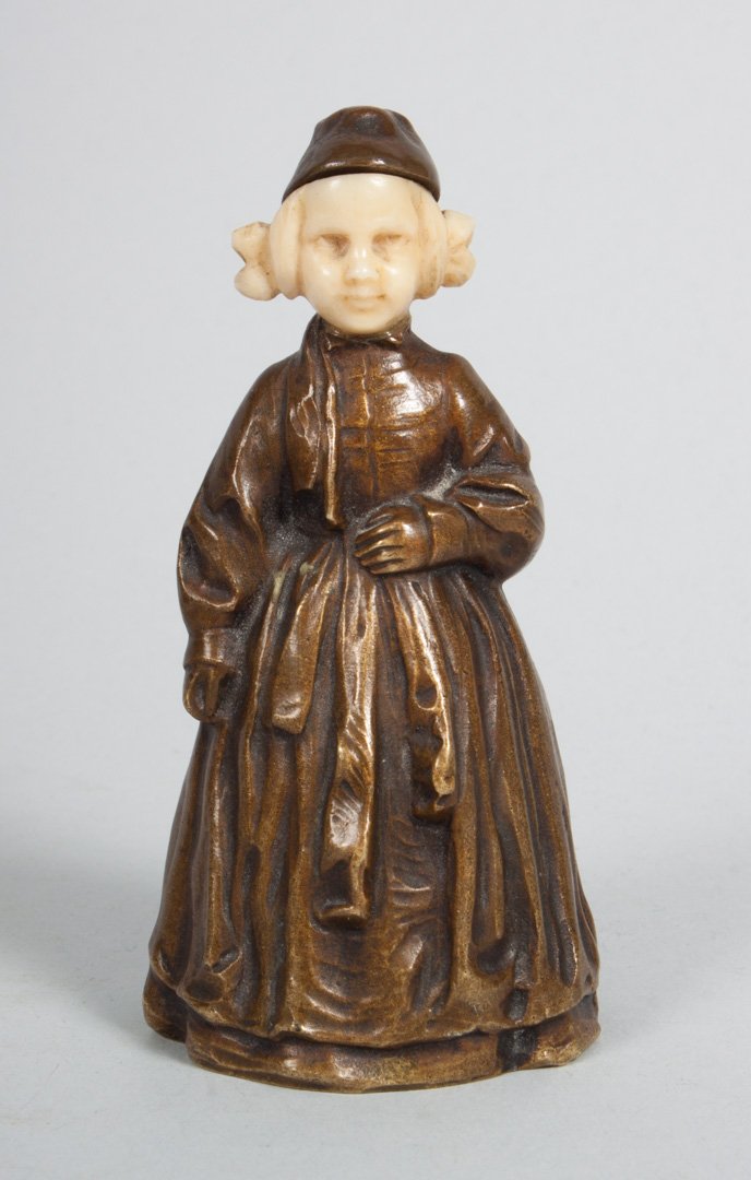 Peter Tereszczuk. Bronze and ivory figural bell: (Austrian, 1875-1963). Figural bronze and ivory bell in the form of a young girl, bronze body and cap with ivory head, signed with monogram and signature "P. Tereszczuk," 4 in. H.