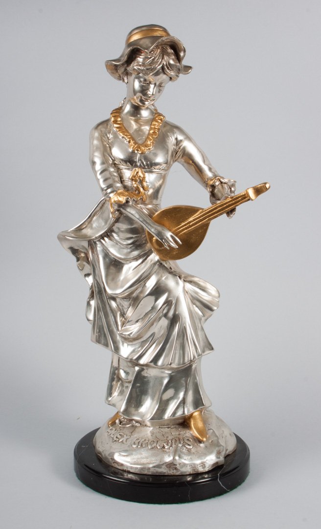 Alex Brown bronze sculpture: (American Contemporary). Female lute player, modeled as woman in 19th century attire playing a lute, silvered and gilt bronze, signed in cast "Alex Brown," mounted on circular marble base, 23 in. H. t