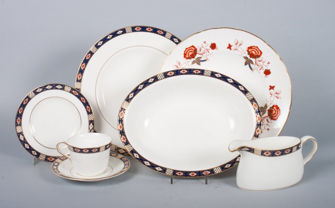 Royal Crown Derby china partial dinner service: in the "Kedleston" pattern, 61 pieces, comprising: 12 dinner plates, 12 luncheon plates, 12 bread plates, 12 teacups, 11 saucers, creamer, serving bowl, and three Royal Crown Derby dinner plates in th