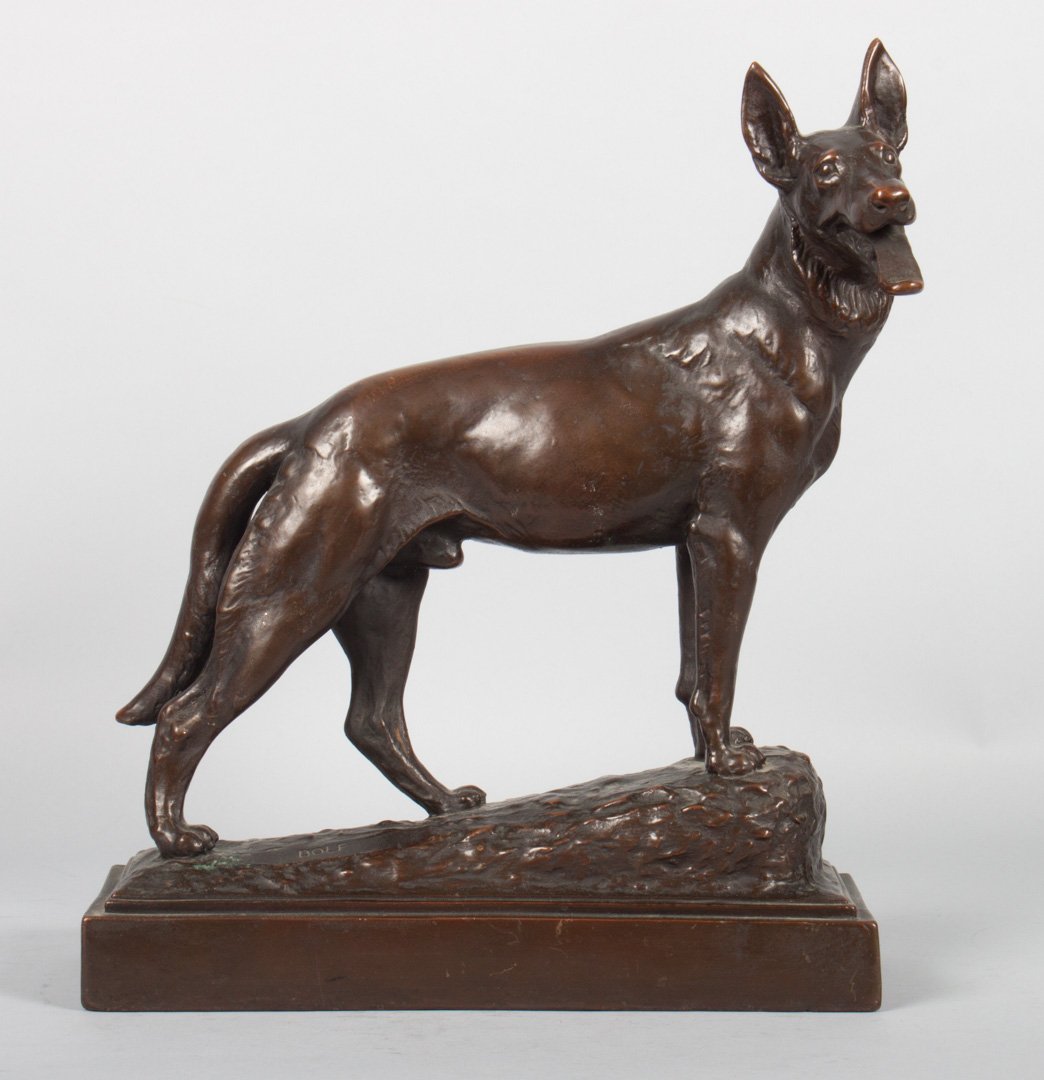 Herzel. "Dolf," bronze dog: Paul Herzel (German, 1876-1956). "Dolf," brown patina, modeled as heroic German Shepherd dog on rocky ledge, signed in cast "Paul Herzel" and titled, 14 in. H., 11 1/2 in. W.