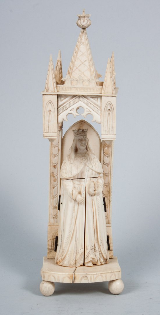 Continental carved ivory devotional shrine: 19th century or earlier; modeled as queen saint standing under Gothic architectural spire, saint's garment opens to reveal relief carved triptych depicting bishop saints, inscribed on verso "W. Coree 