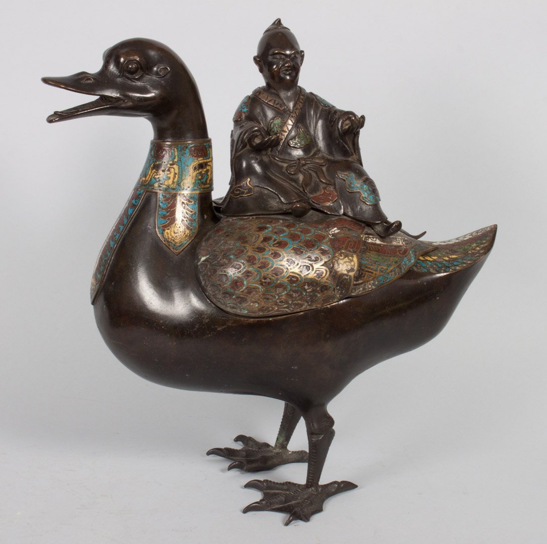 Chinese bronze and champleve censer: late 19th century; modeled as deity riding a large duck, bronze body with champleve highlights, 15 in. H.