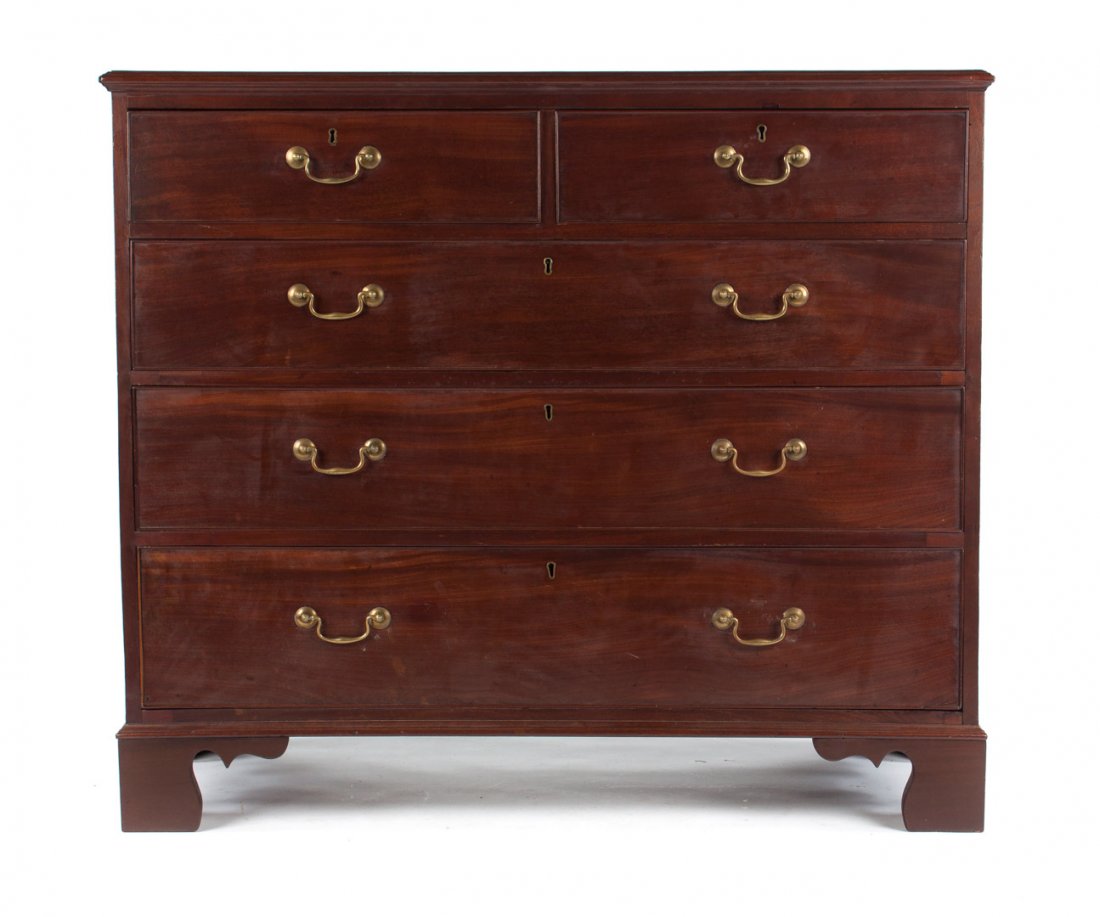 George III mahogany chest of drawers: flat top with banded inlaid edge, two short over three long drawers with original rosette and bale brasses, straight bracket feet, 41 in. H., 47 in. W., 22 in. D.