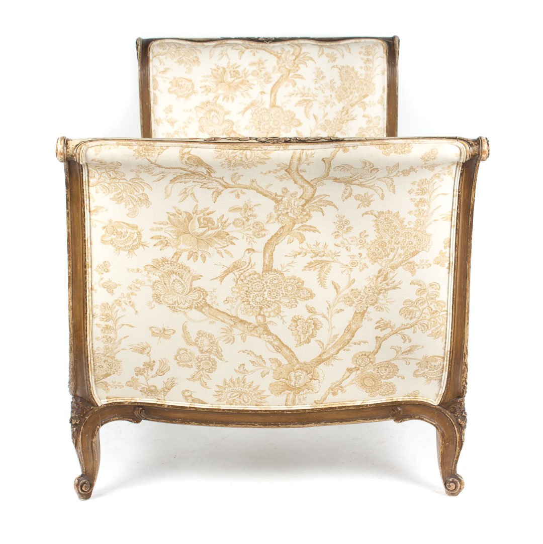 Louis XVI style carved and painted daybed: toile upholstered paneled head and footboard, carved and pickled wood exposed frame, 36 in. H.