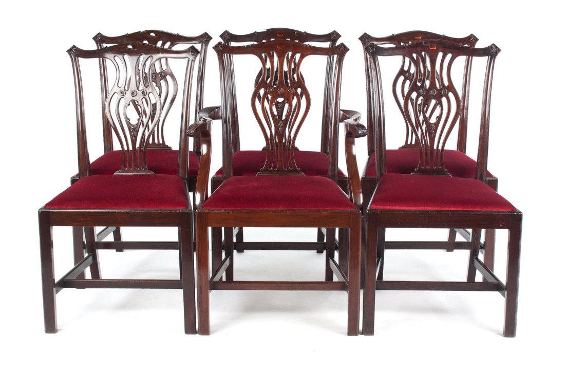 Six George III style carved mahogany dining chairs: shaped crest rails, pierced vasiform splats, slip seats and straight legs, 37 1/2 in. H., 24 in. W.