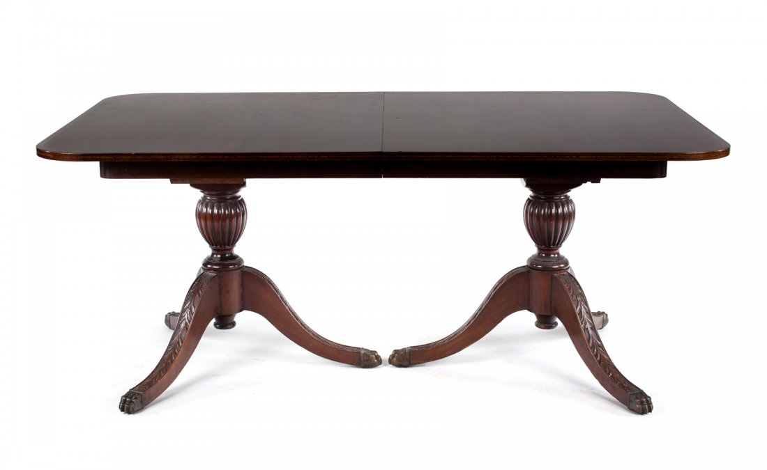 Federal style mahogany dining table: two 36 in. banded inlaid ends with two 12 in. extension leaves, double pedestal base, 30 in. H., 44 in. D.