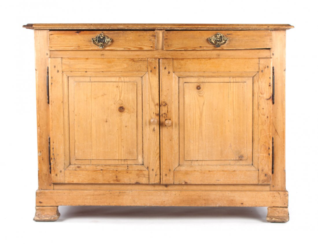 French country pine buffet: flat top with molded edge, two medium drawers and cupboard beneath enclosed by solid panel doors, bracket feet, 39 in. H., 52 1/2 in. W., 25 in. D.