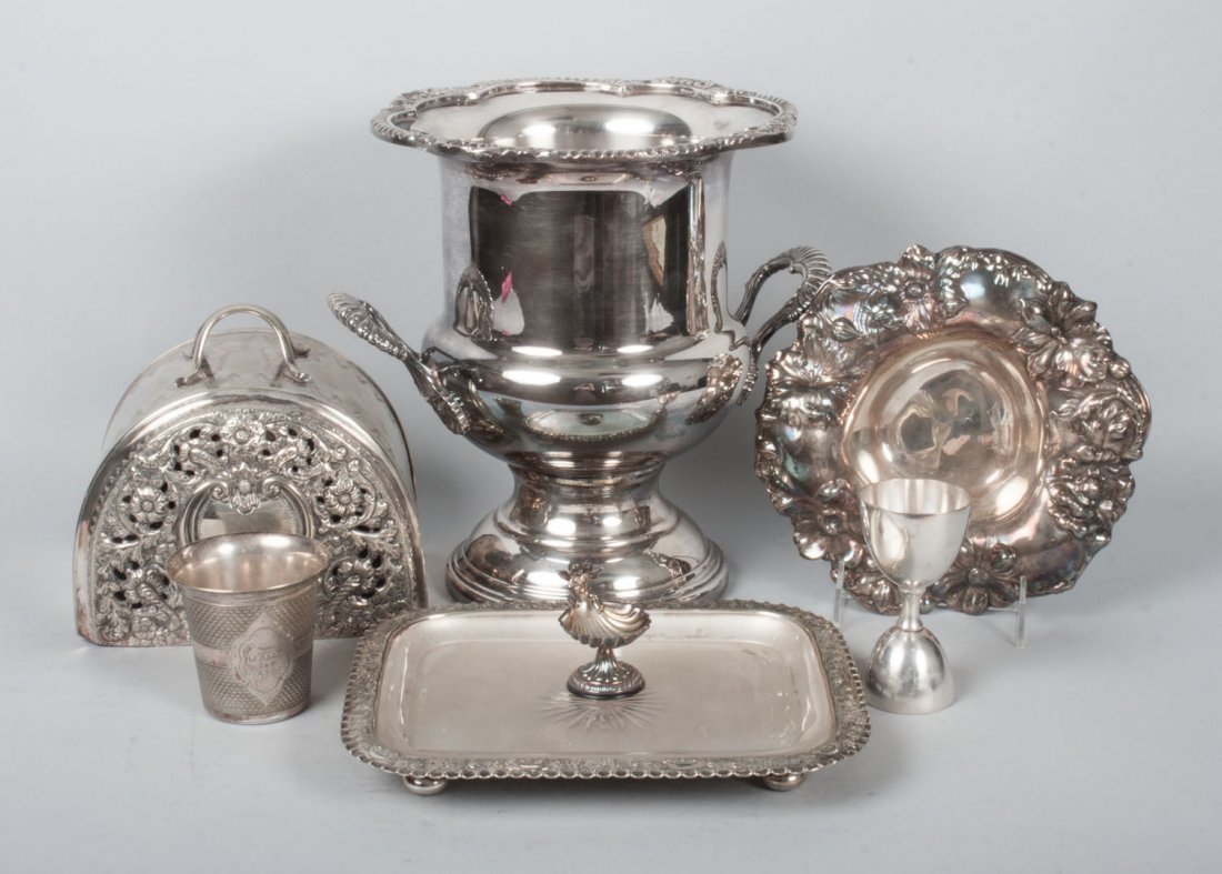 Six silver-plated table articles: including: cheese dome, urn-shaped wine cooler, Art Nouveau bowl, angel shell salt, engine-turned cup, and a bar measure cup
