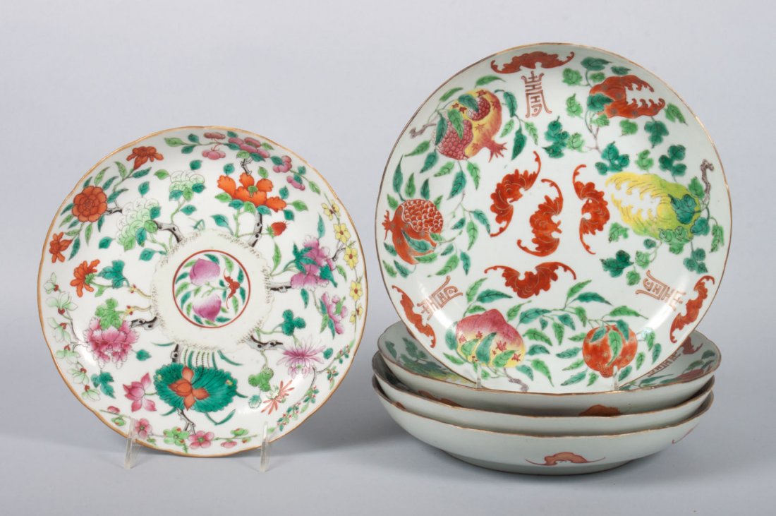 Five Chinese Famille Rose porcelain plates: second half-19th century; set of four with pomegranate and bat decoration, four character mark underneath, 9 1/2 in. Diam., and a floral and pomegranate decorated Famille Rose porcelain plate with fou